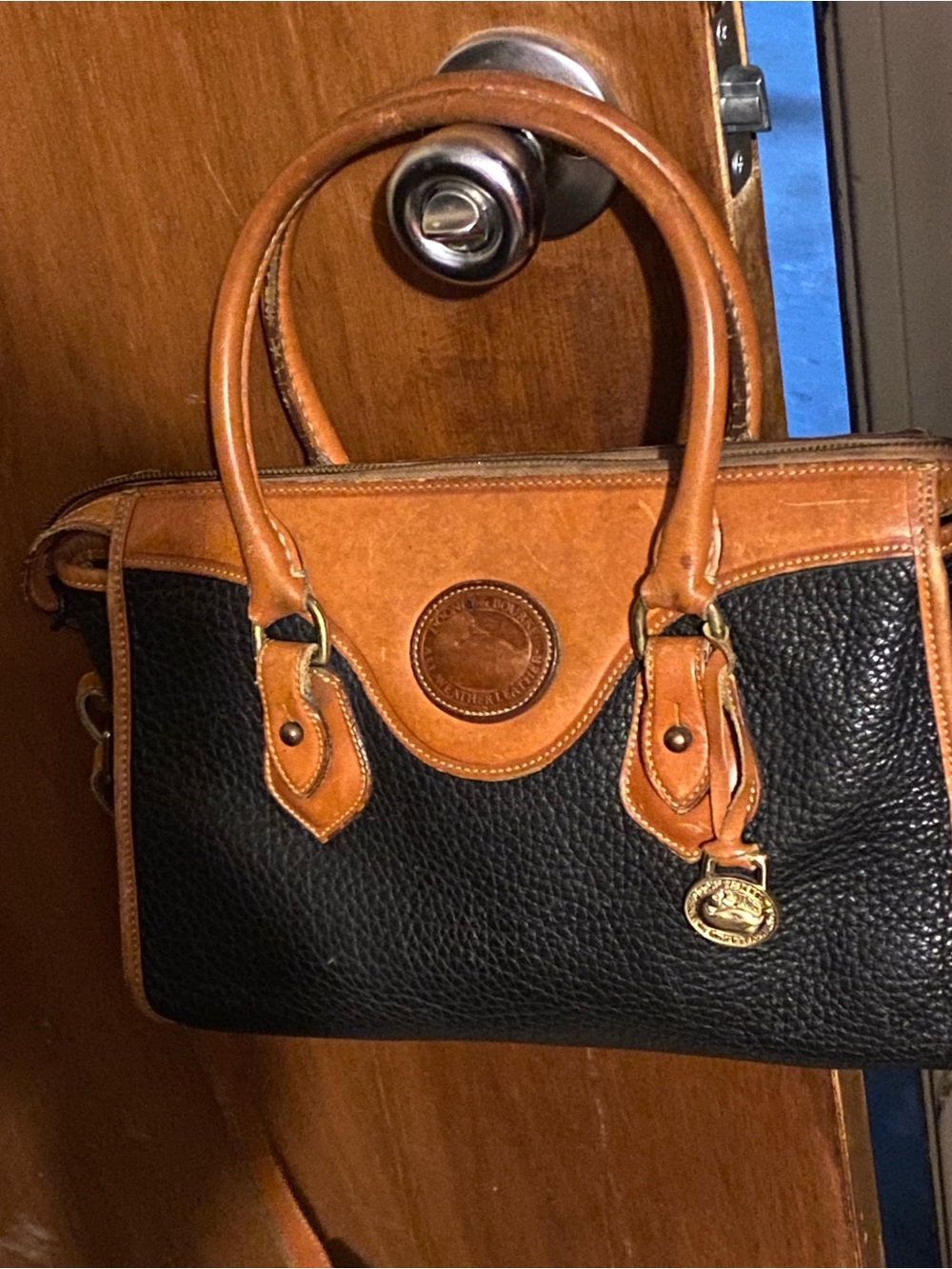 Dooney & Bourke Black and Tan Pebbled Leather Satchel
